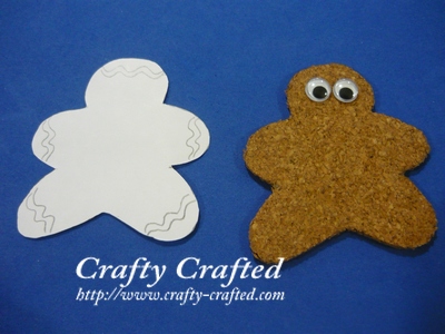 Trace the ginger bread man onto a white piece of paper. Cut out the strips as the 'icing' and glue them onto the ginger bread man.