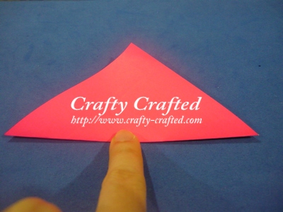 Fold a square paper half.