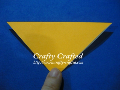 Fold a square paper half.