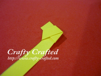 Start with a strip of paper. Tie a “knot” in the end of your paper.